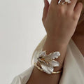 Gold & White Floral Statement Bracelet – Sculpted Petal Design, Adjustable Fit